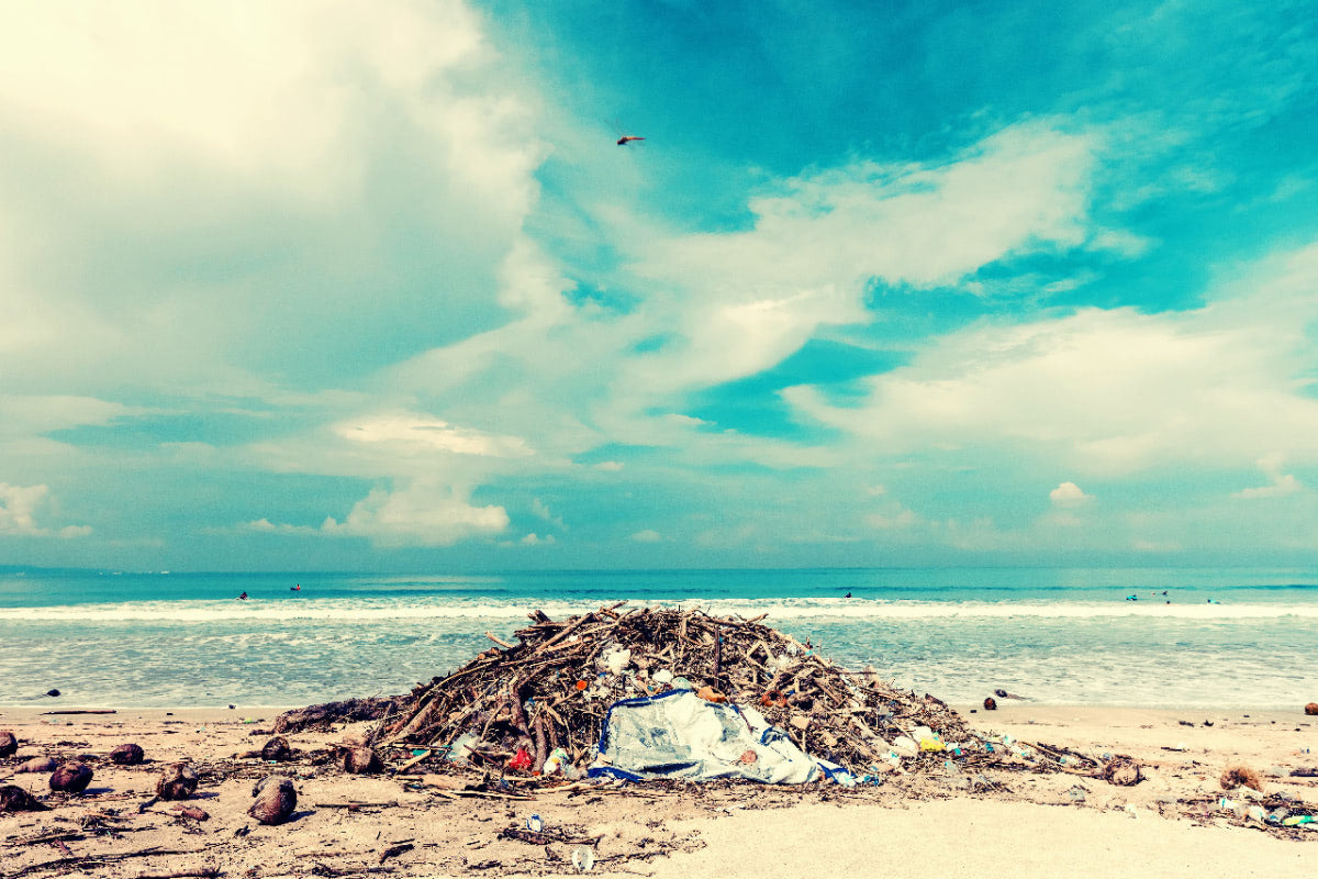 Rubbish on beach with blue skies