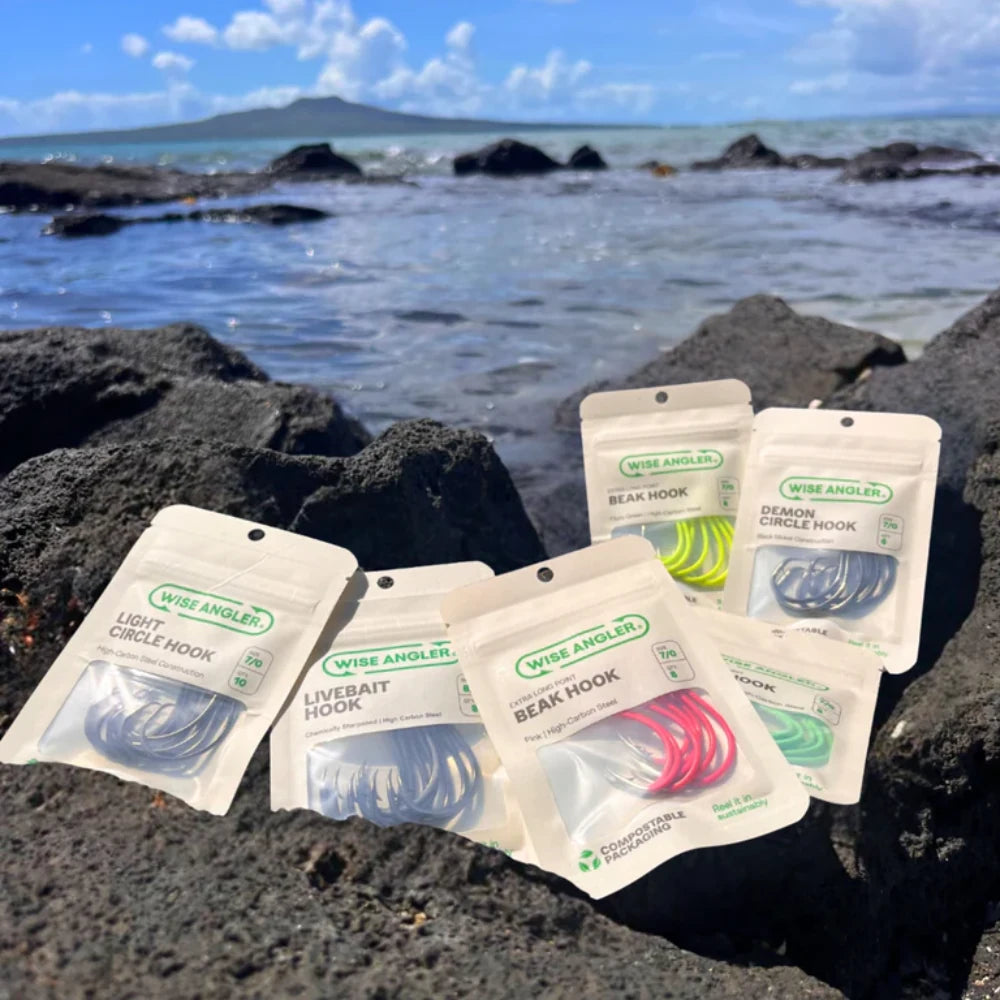 Wise Angler packs on rocks by the sea