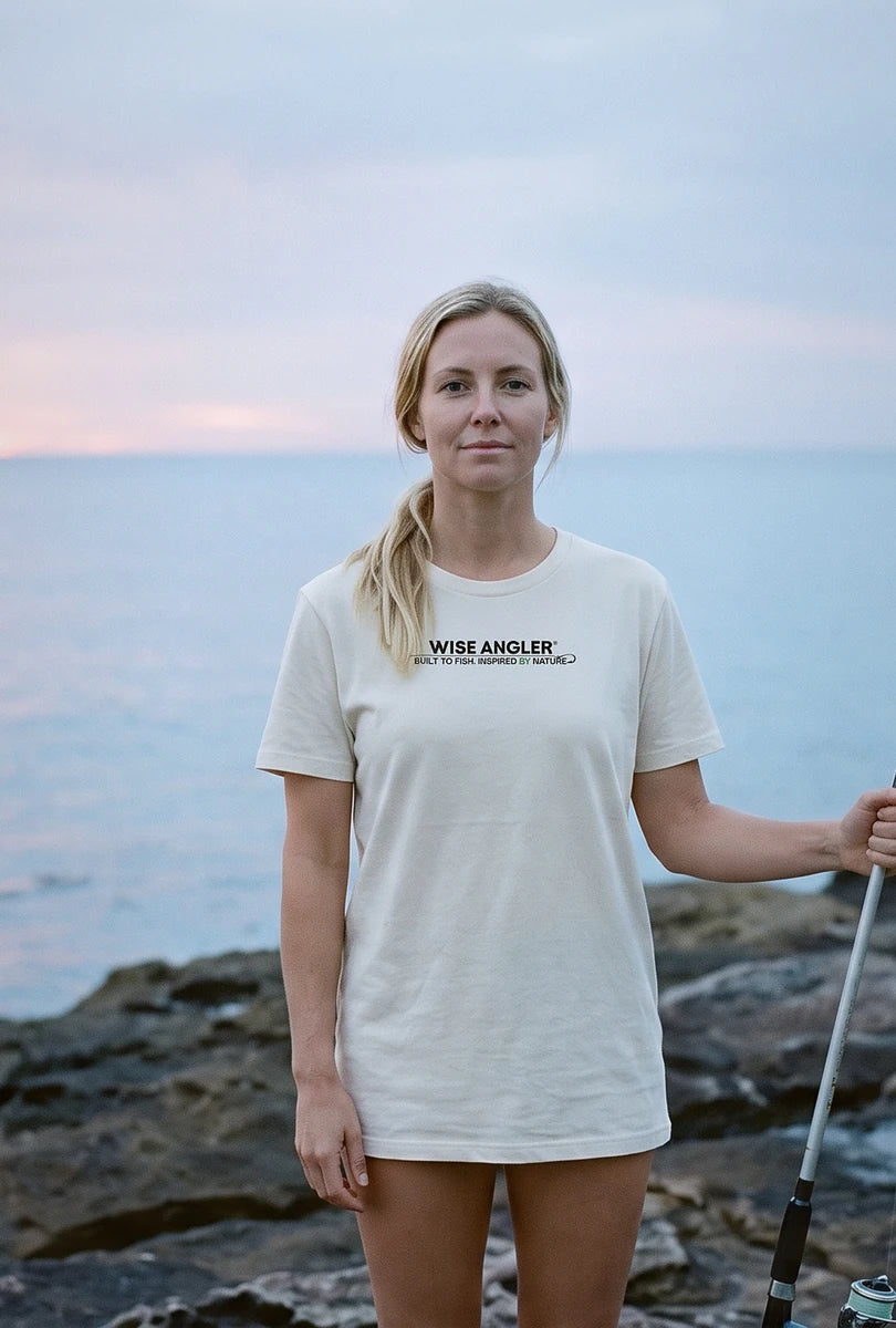 Angler on the rocks in the sand Wise Angler T-Shirt