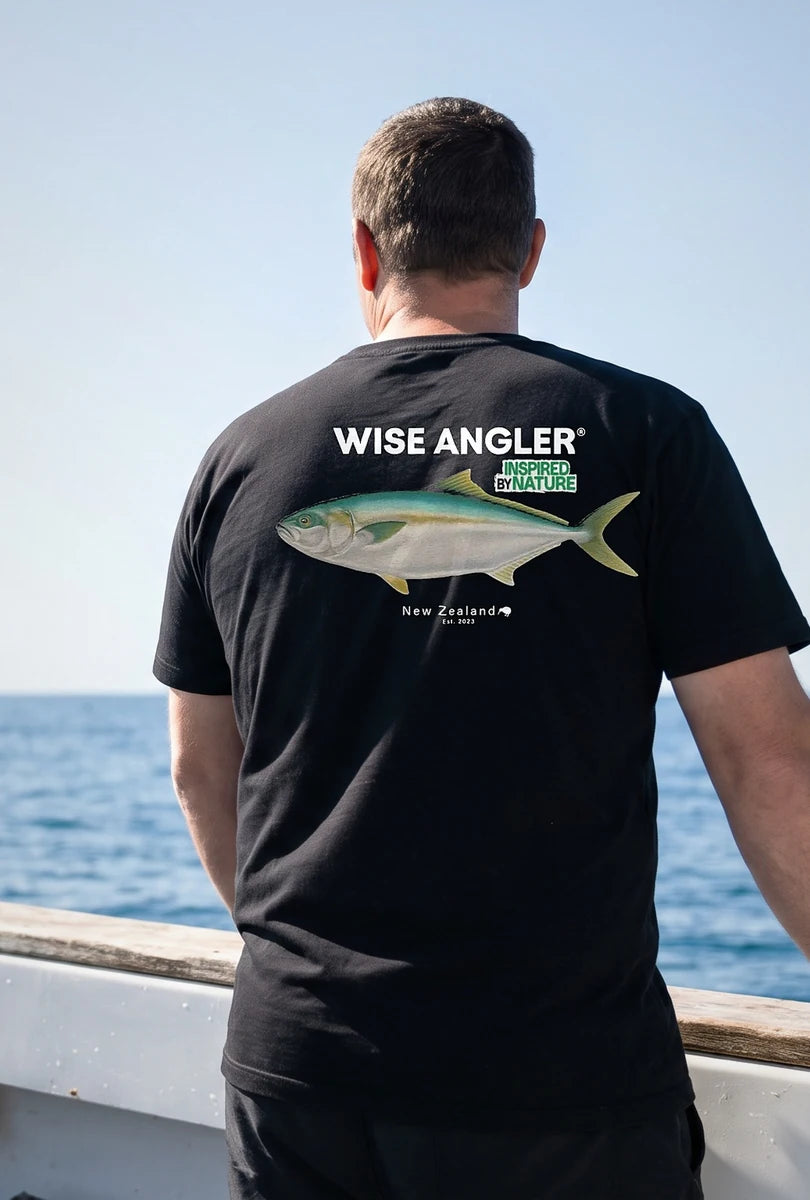 Angler on a boat, back to camera, wearing the 30 lbs Club Kingies tee
