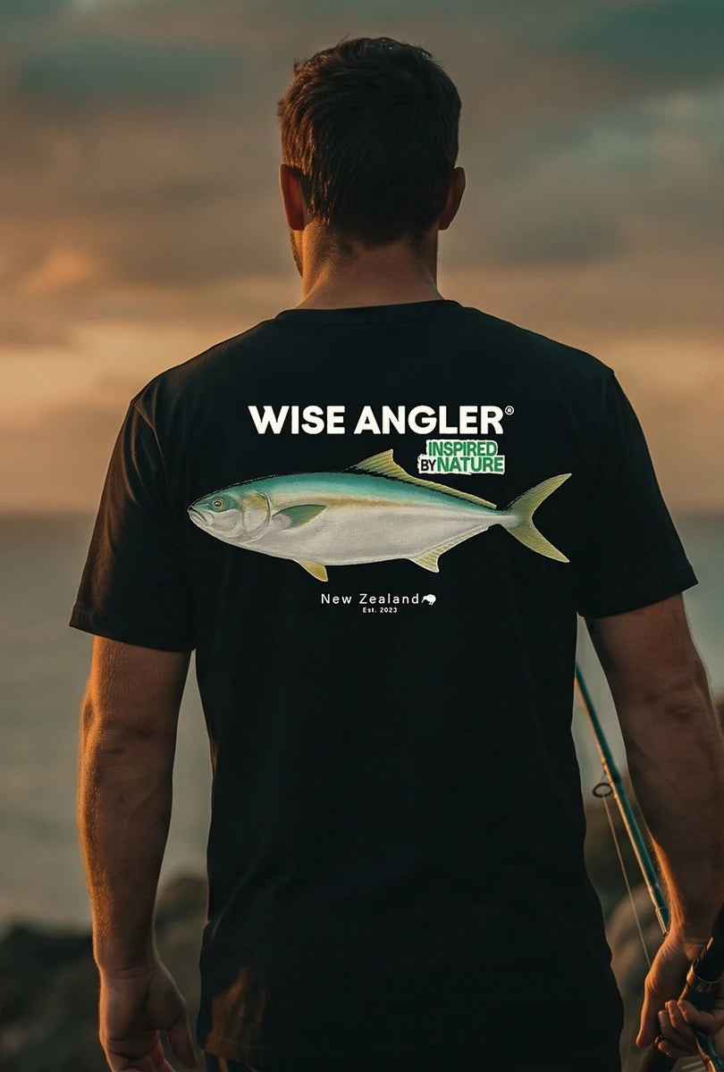 Angler at sunset, back to camera, in the 30 lbs Club Kingies tee